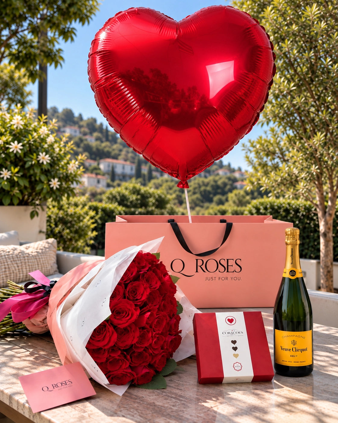 QRoses luxury gift set with 50 red roses, oversized red heart balloon, Arcádia chocolates and Veuve Clicquot champagne.